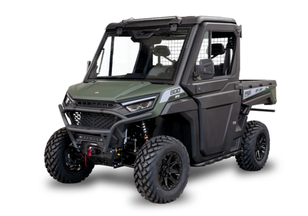 Green and black off road utility vehicle with a protective roll cage and large tires front bumper guard and cargo bed on a white background